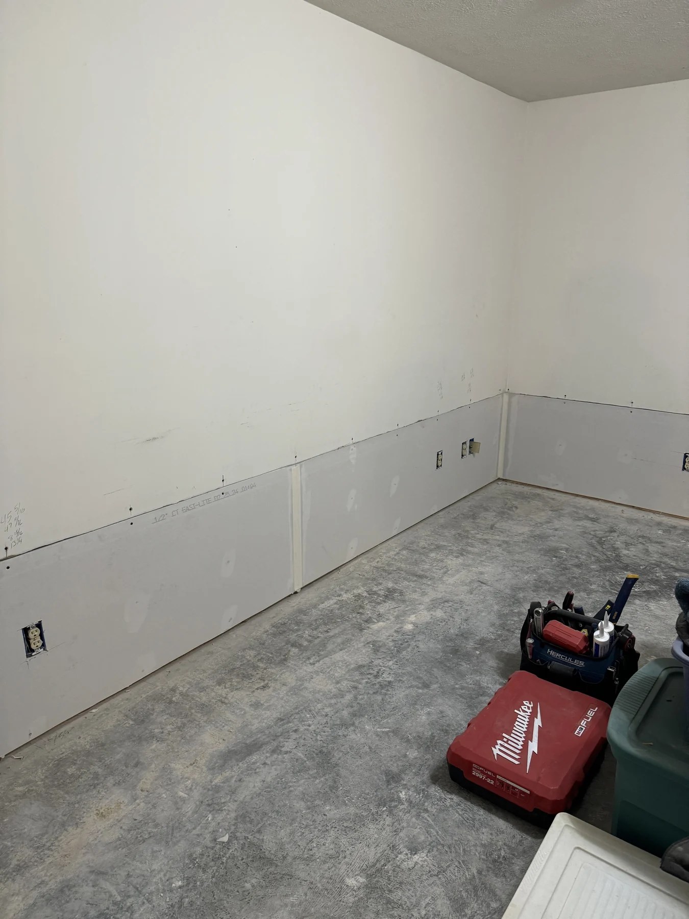 Interior renovation with drywall repairs underway